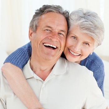 An older couple with dental implants in Loganville, GA